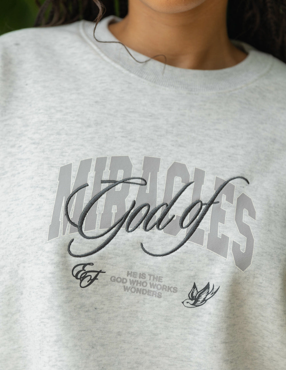 Elevated Faith Christian Crewneck Sweatshirt featuring 'God of Miracles' graphic design