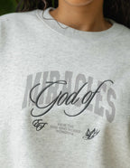 Elevated Faith Christian Crewneck Sweatshirt featuring 'God of Miracles' graphic design