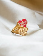 Gold heart-shaped ring with engraved 'God is Love', part of Elevated Faith's Christian Jewelry collection