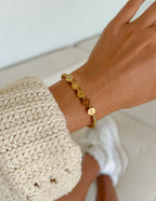 Elevated Faith Christian Jewelry Bracelet featuring gold letters spelling 'FAITH' on a delicate chain