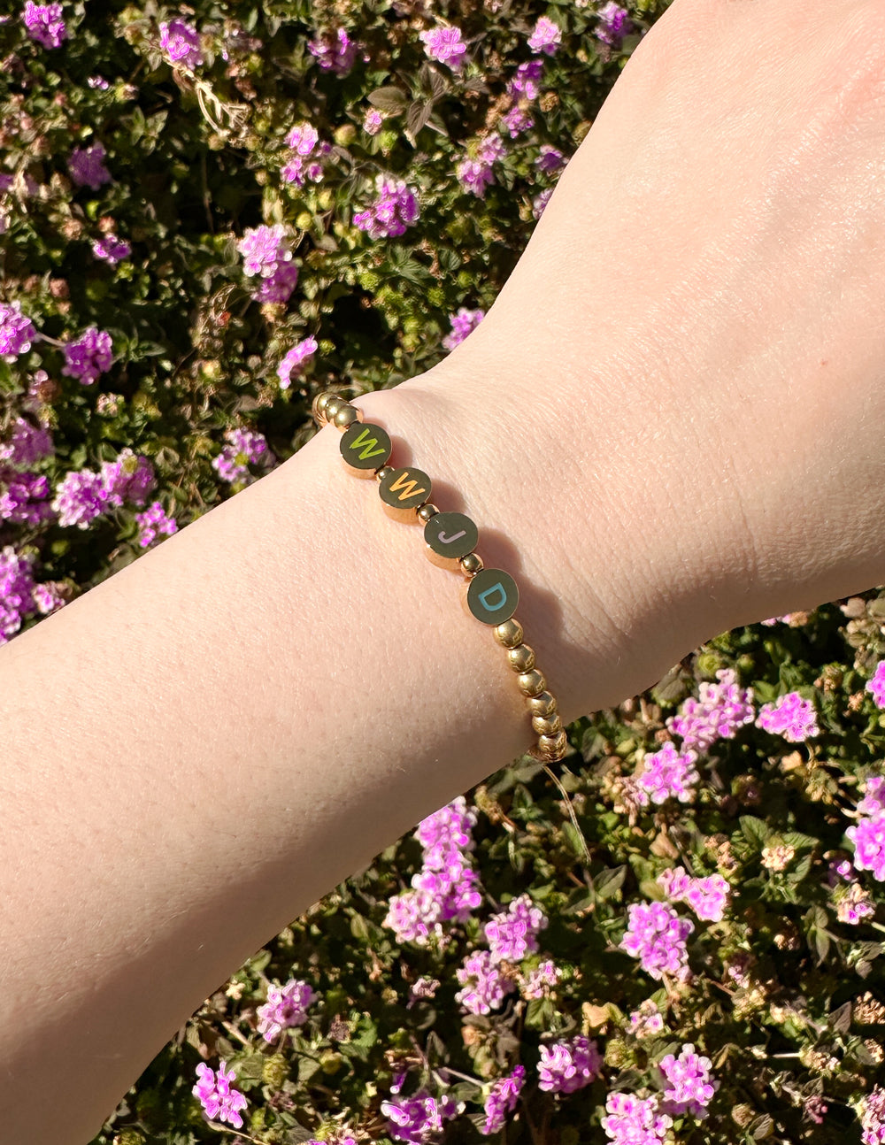 Elevated Faith Christian Jewelry Bracelet with letters 'WWJD' on a beaded design
