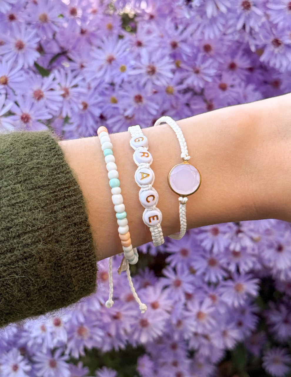 Elevated Faith Christian Jewelry Bracelet with bead letters spelling grace and pastel colors on a wrist