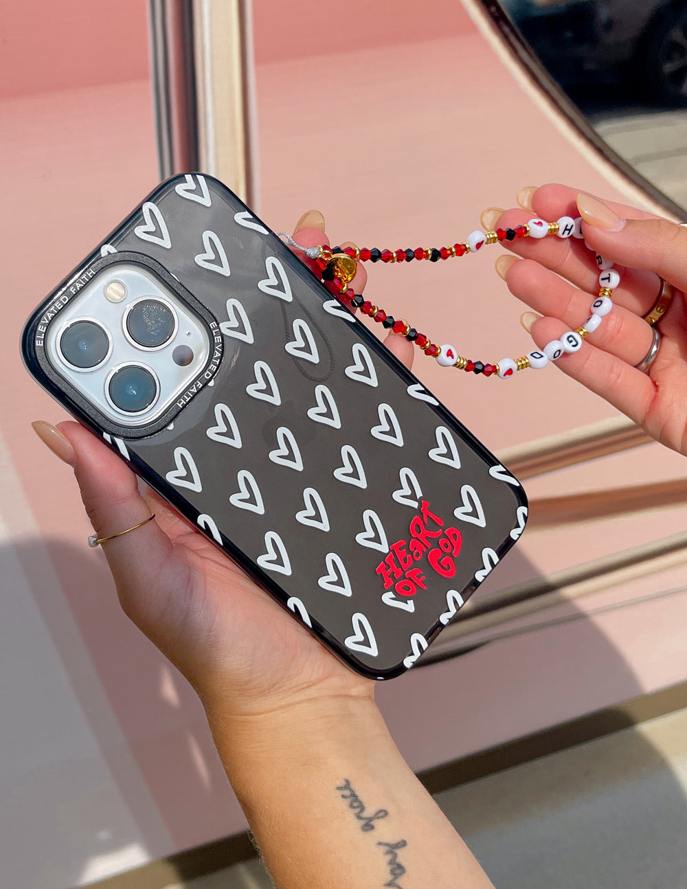 Elevated Faith Christian iPhone Case with a Heart Design and Colorful Beaded Strap