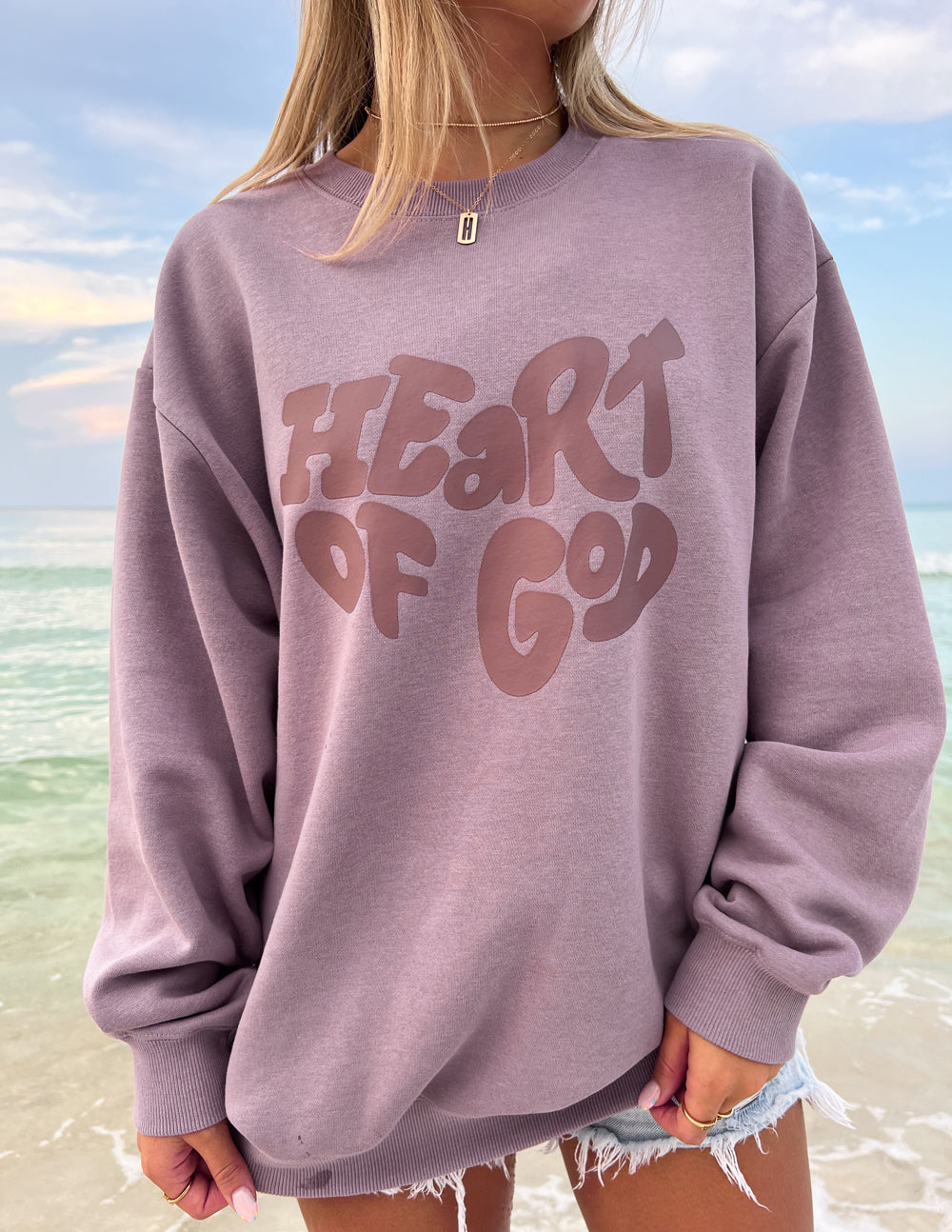 Elevated Faith Christian Crewneck Sweatshirt featuring 'Heart of God' graphic design in purple