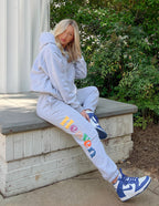 Elevated Faith Gray Sweatpants featuring colorful lettering, perfect for Christian apparel enthusiasts