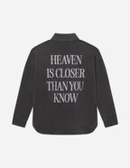 Elevated Faith Christian Jacket in dark color featuring the message Heaven is Closer Than You Know on the back