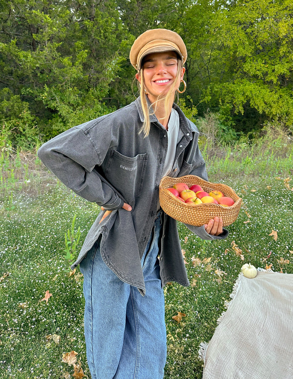 Elevated Faith Christian Jacket in gray, styled with casual jeans and a hat for a relaxed look