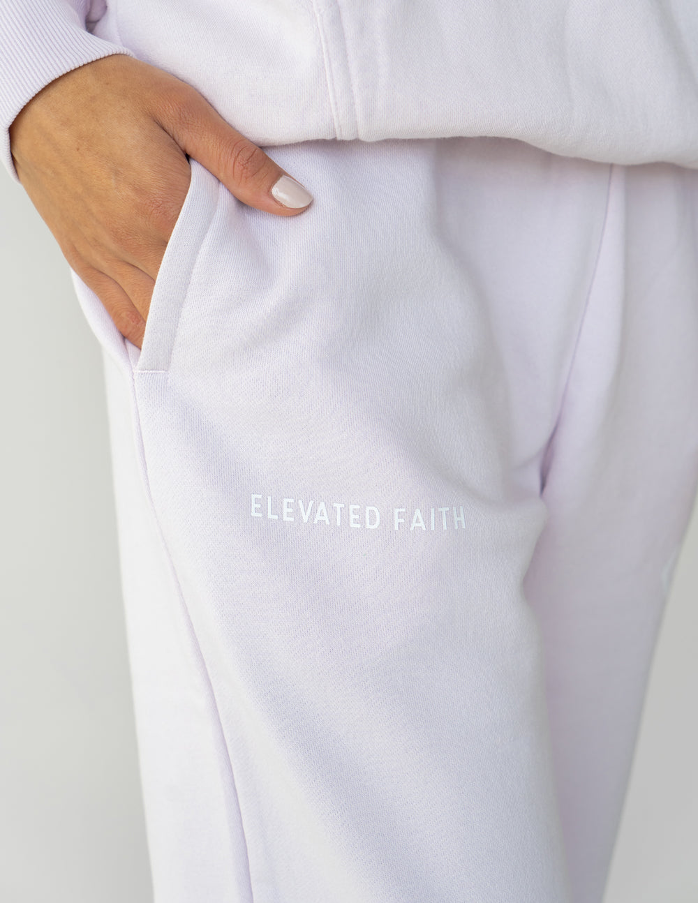 Elevated Faith Lavender Sweatpants featuring a pocket and embroidered logo, perfect Christian Apparel