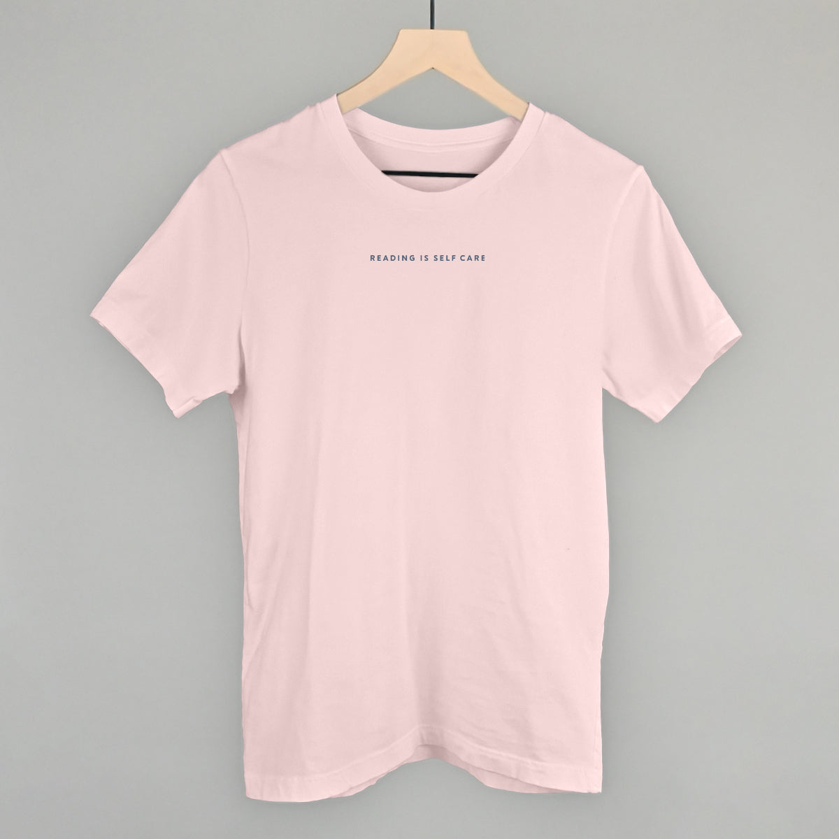 Reading Is Self Care Book Lover graphic tee in Soft Pink