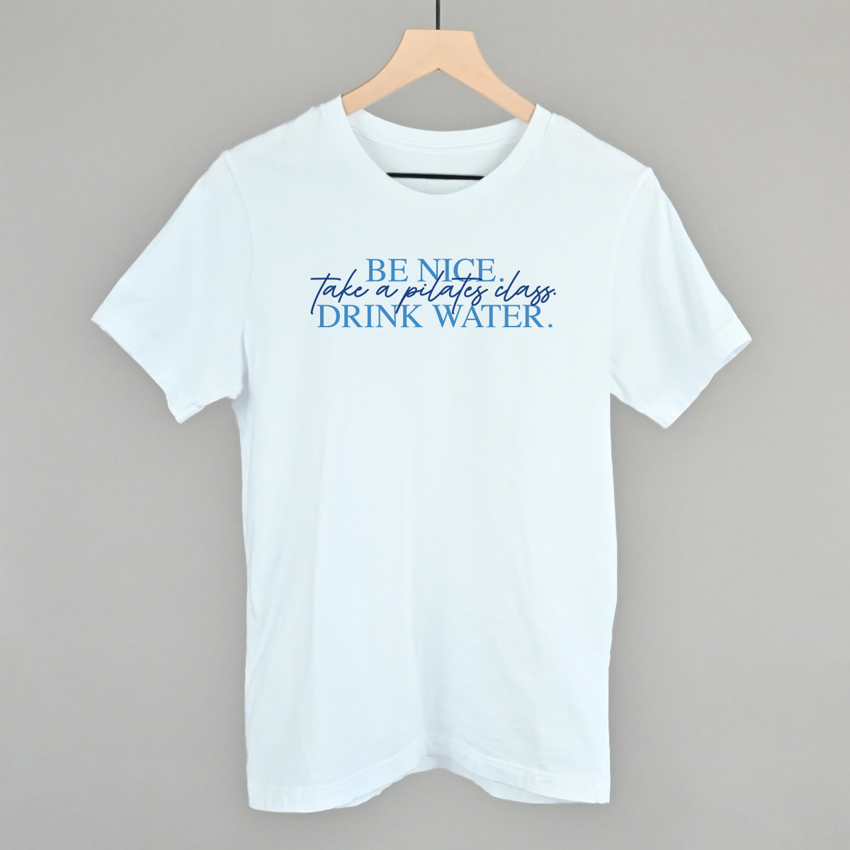Be Nice, Take A Pilates Class, Drink Water graphic tee in White