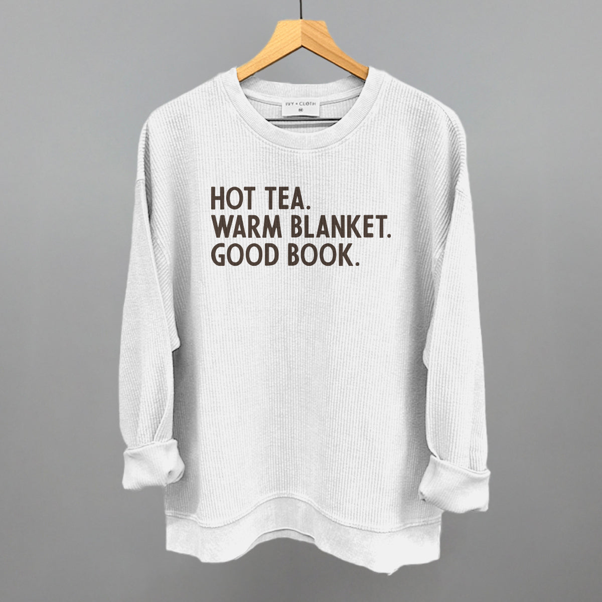 Hot Tea, Warm Blanket, Good Book Cozy graphic oversized corded crew in White