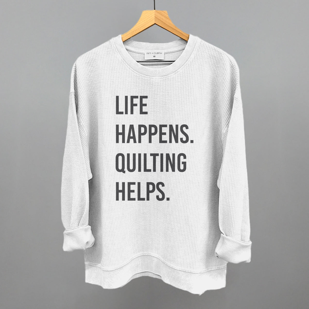 Life Happens Quilting Helps graphic oversized corded crew in White