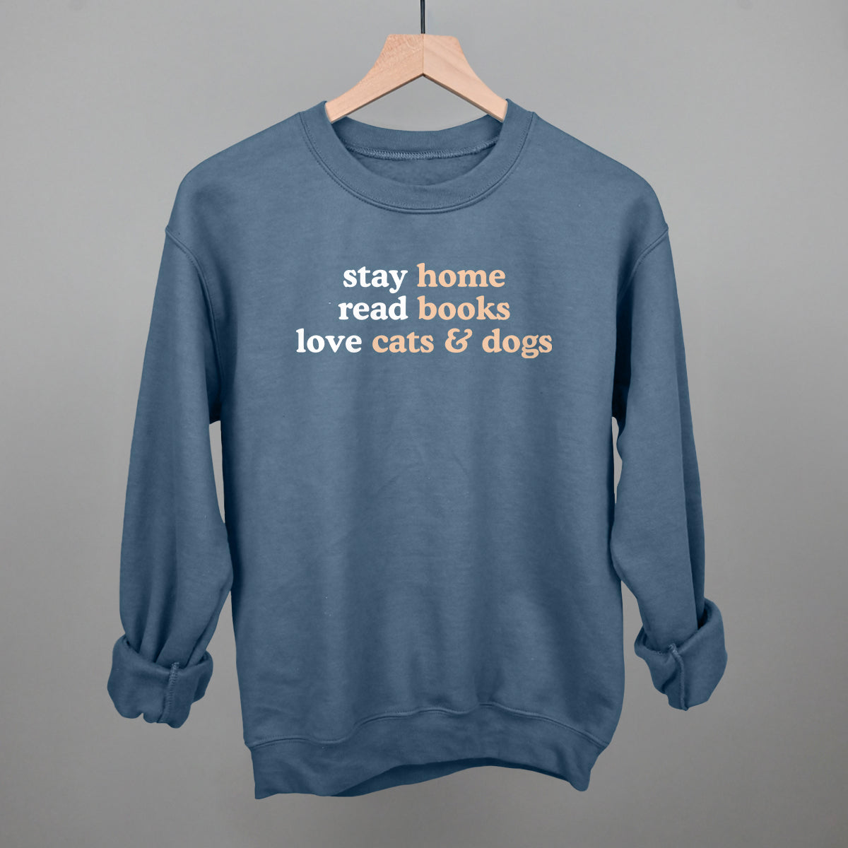 Stay Home Read Books Love Cats & Dogs graphic crewneck sweatshirt in Indigo Blue