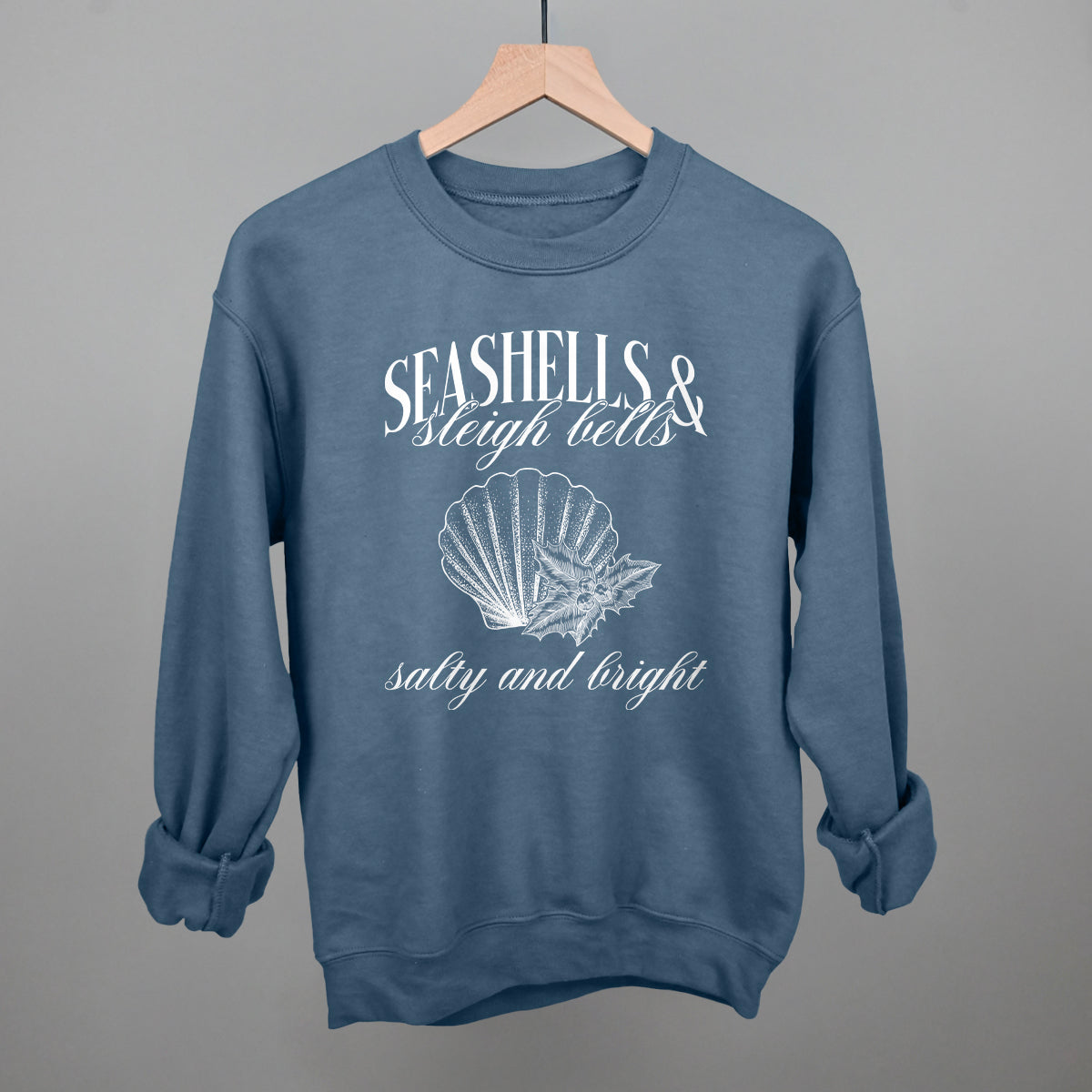 Seashells & Sleigh Bells Coastal Christmas graphic crewneck sweatshirt in Indigo Blue