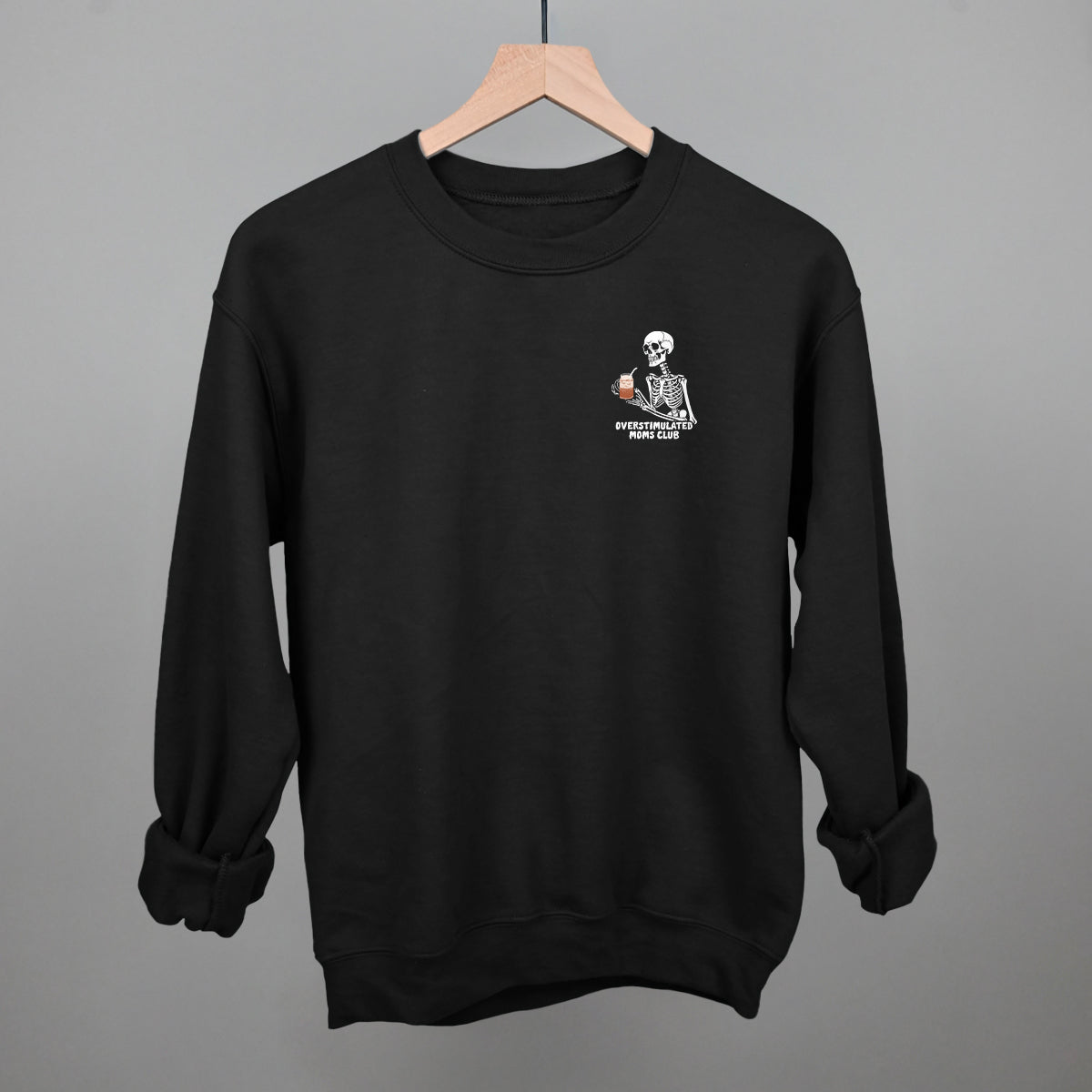 Overstimulated Moms Club Skeleton Coffee graphic crewneck sweatshirt in Black