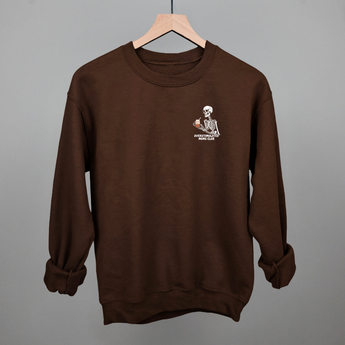 Overstimulated Moms Club Skeleton Coffee graphic crewneck sweatshirt in Chocolate