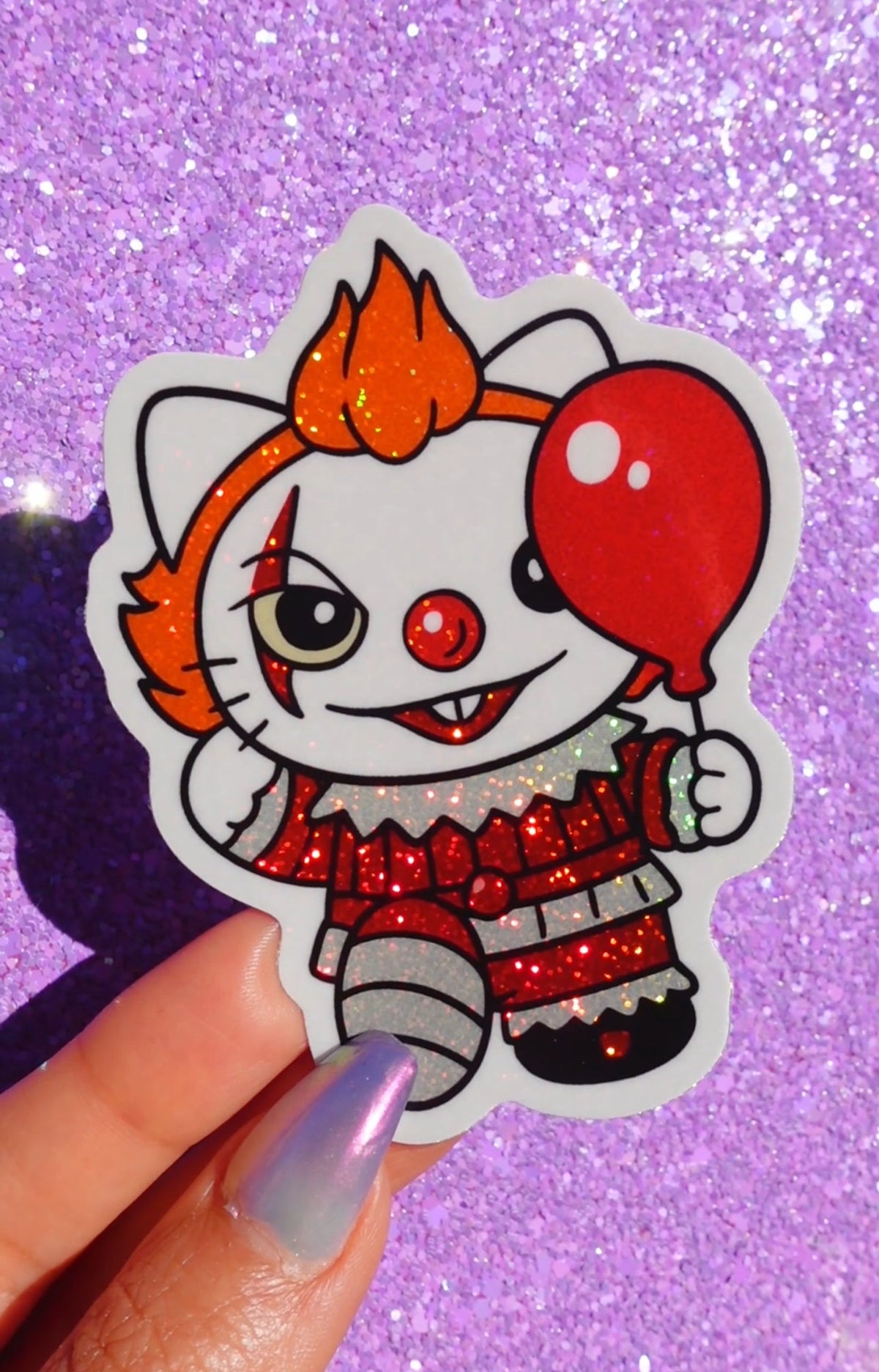 Funny Chibi horror clown glitter vinyl sticker with orange hair, red nose, and red sparkly outfit