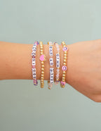 Colorful Elevated Faith Christian Jewelry Bracelet stack featuring inspirational letter beads
