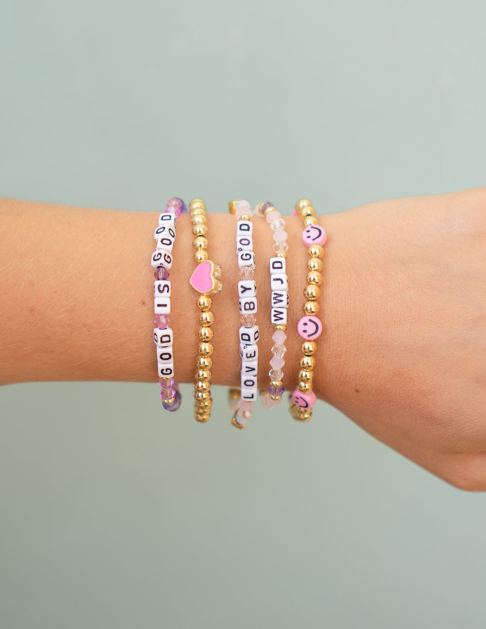 Colorful Elevated Faith Christian Jewelry Bracelet stack featuring inspirational letter beads