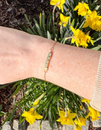 Elevated Faith Christian Jewelry Bracelet displayed on a wrist with a floral background
