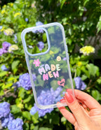 Elevated Faith Christian iPhone Case with colorful floral design and inspirational text 'Made New'
