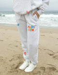 Elevated Faith gray sweatpants with colorful 'Made New' design, perfect for Christian Apparel enthusiasts