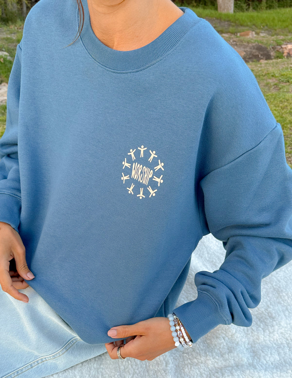 Elevated Faith Christian Crewneck Sweatshirt in blue with 'Worship' graphic design