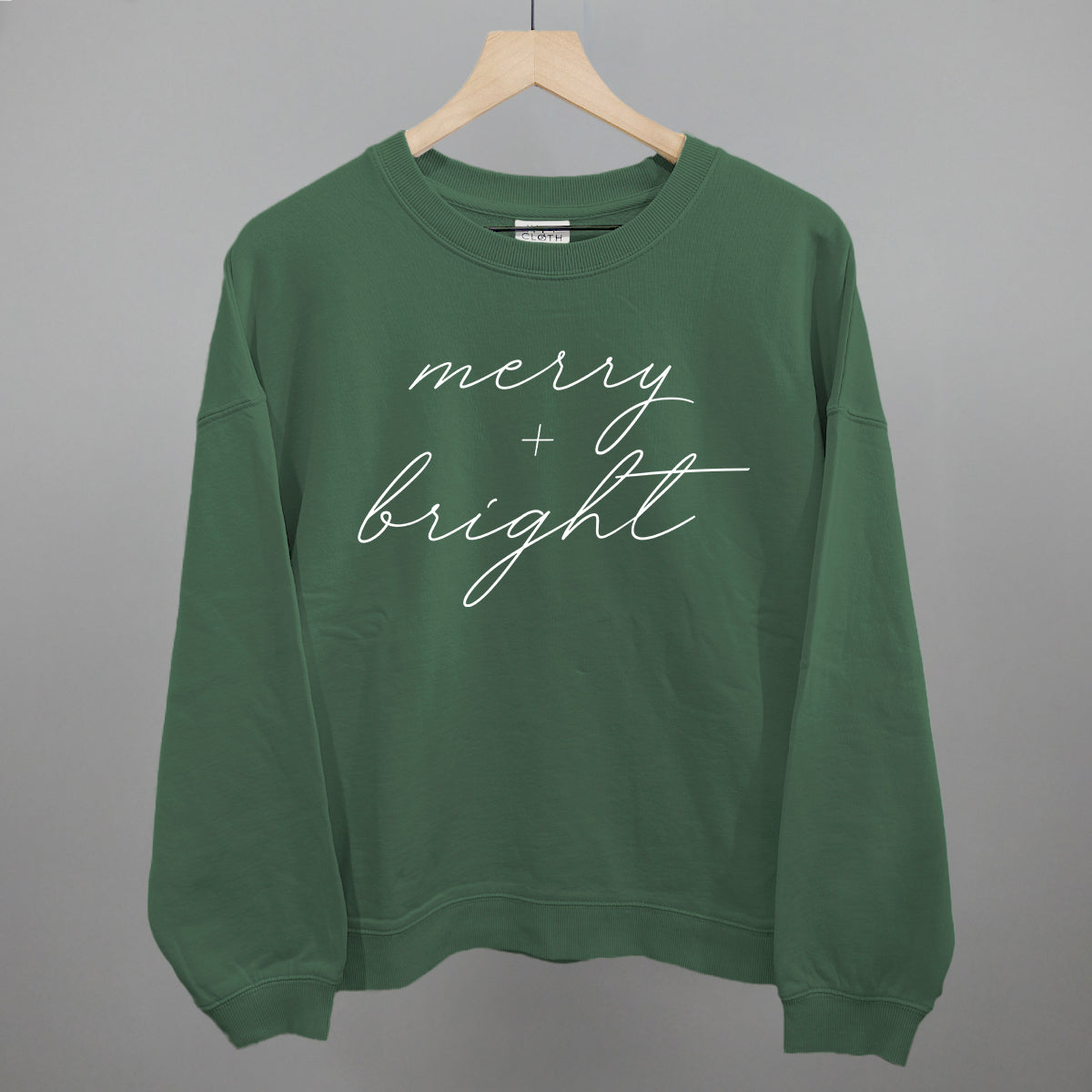 Merry And Bright White Script Funny Oversized Boxy Crewneck Sweatshirt in Myrtle – Ivy + Cloth