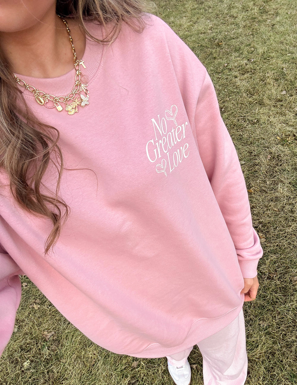 Elevated Faith Christian Crewneck Sweatshirt in pink featuring 'No Greater Love' embroidery