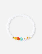 Elevated Faith Christian Jewelry Bracelet with colorful beads spelling peace on a white elastic band