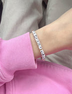 Elevated Faith Christian Jewelry Bracelet with letter beads spelling Perfect Love on a wrist