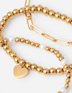 Elegant Elevated Faith Christian Jewelry Bracelet featuring gold and pearl beads with a heart charm