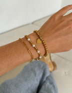 Stylish Christian Jewelry Bracelet featuring gold beads and a heart charm for a faith-inspired look