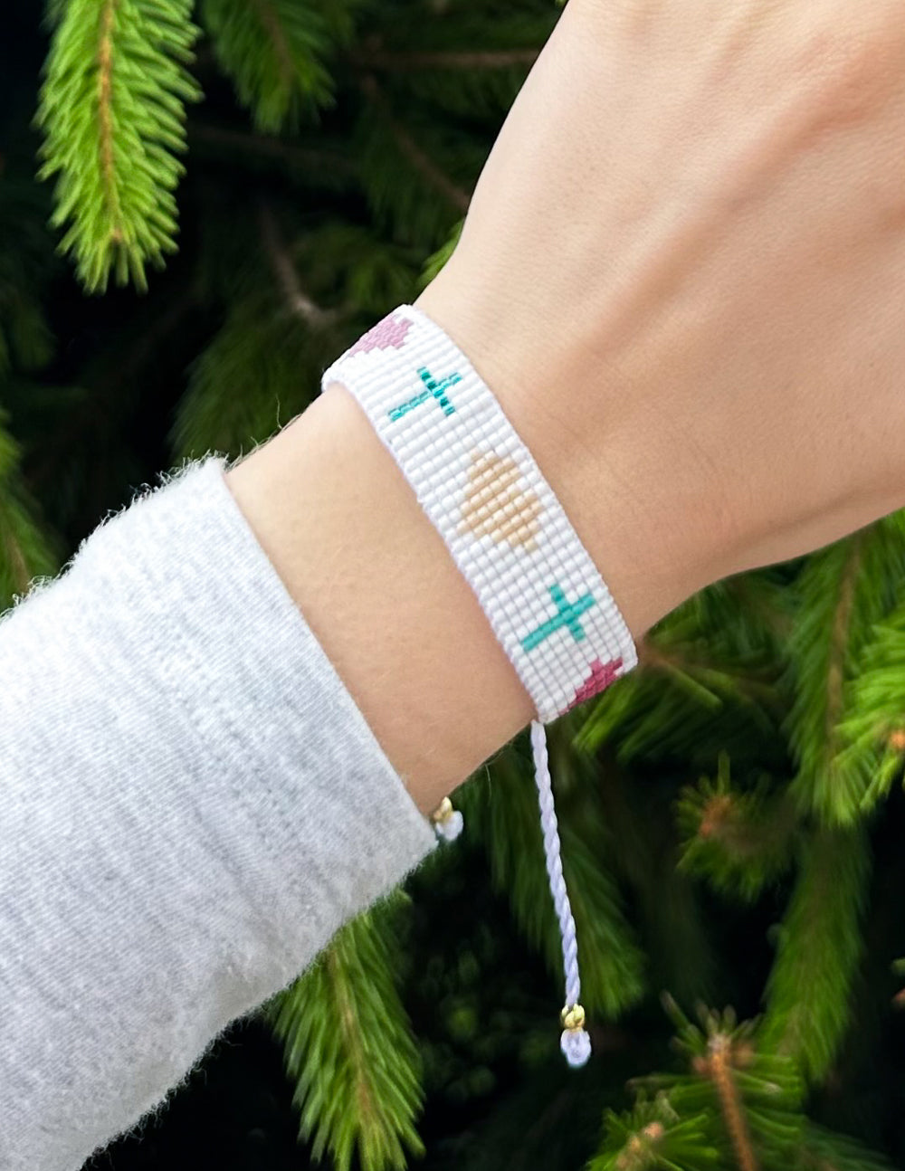 Elevated Faith Christian Jewelry Bracelet with colorful beads and adjustable cord on a wrist