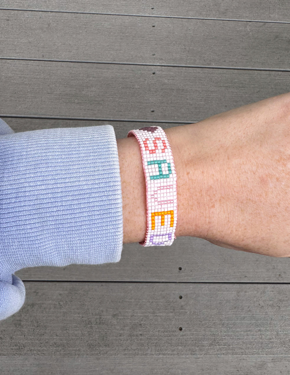 Elevated Faith Christian Jewelry Bracelet with colorful letter beads spelling 'SPARED'