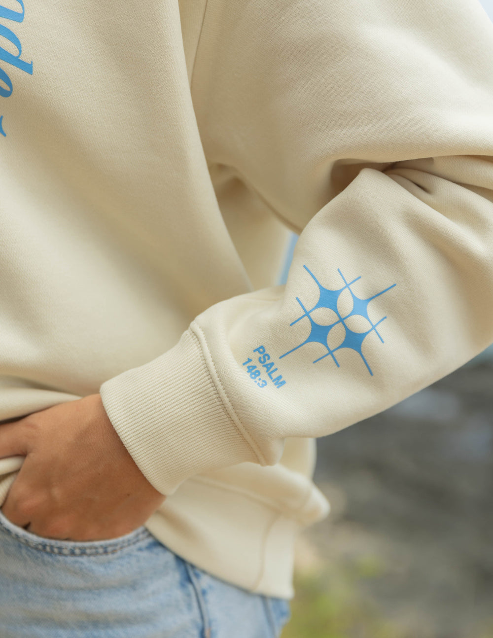 Elevated Faith Christian Crewneck Sweatshirt in cream featuring Psalm 142:3 graphics on the sleeve