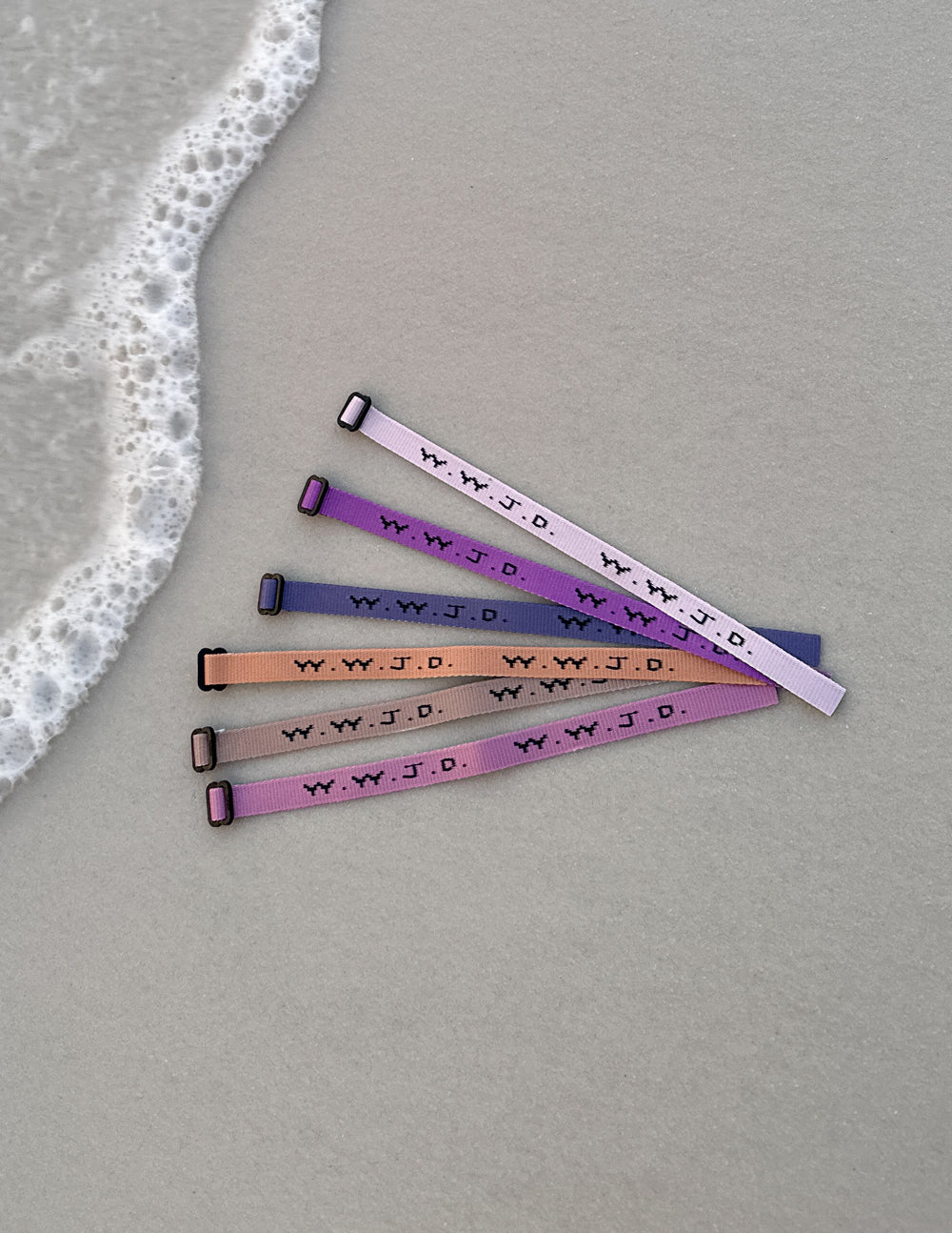 Elevated Faith Christian Jewelry Bracelet set in pastel colors featuring 'W.W.J.D.' message for inspiration