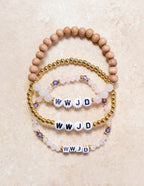 Set of WWJD Christian Jewelry Bracelets featuring beads in natural wood and gold with decorative accents