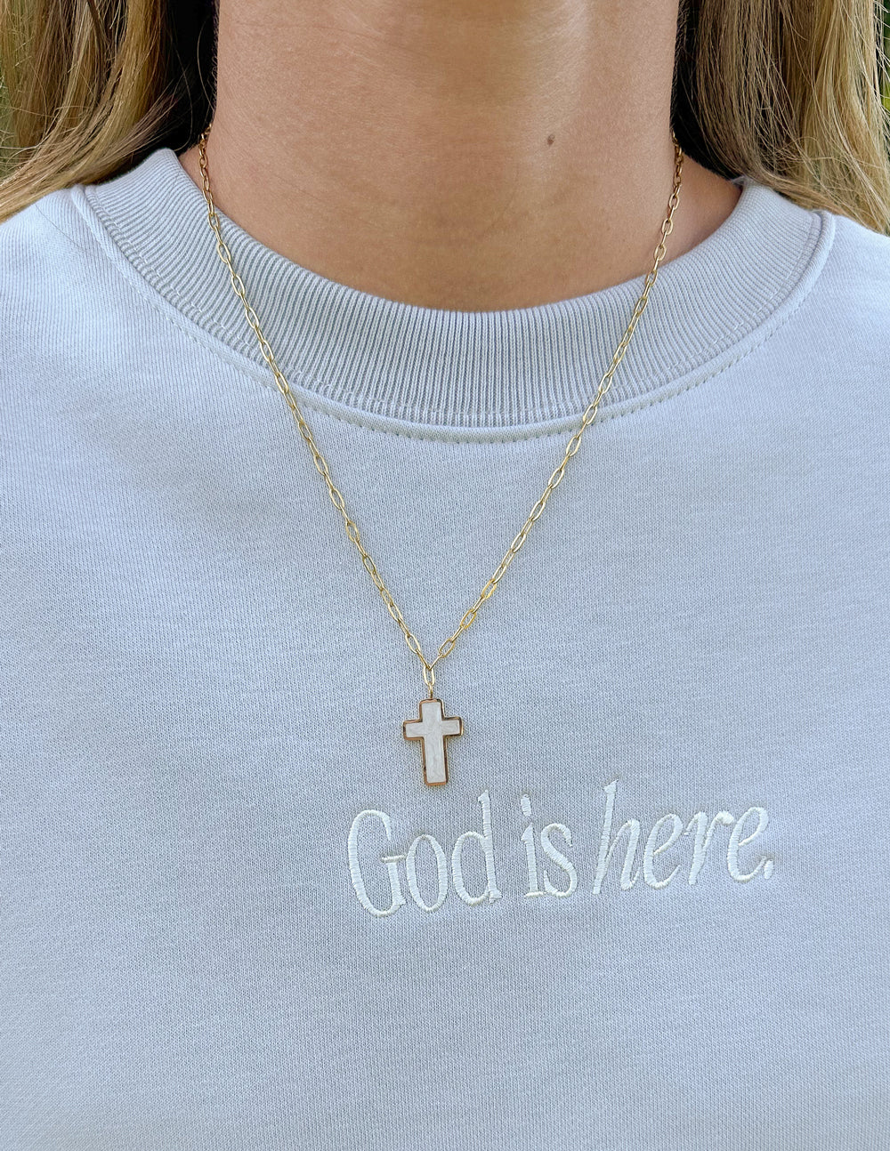Gold chain necklace featuring a cross pendant, a perfect piece of Christian Jewelry