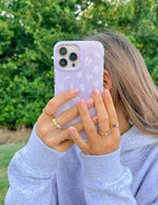 Christian iPhone Case with Floral Design Held by a Person Outdoors