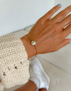 Elevated Faith Christian Jewelry Bracelet with a delicate gold chain and elegant charm on a wrist