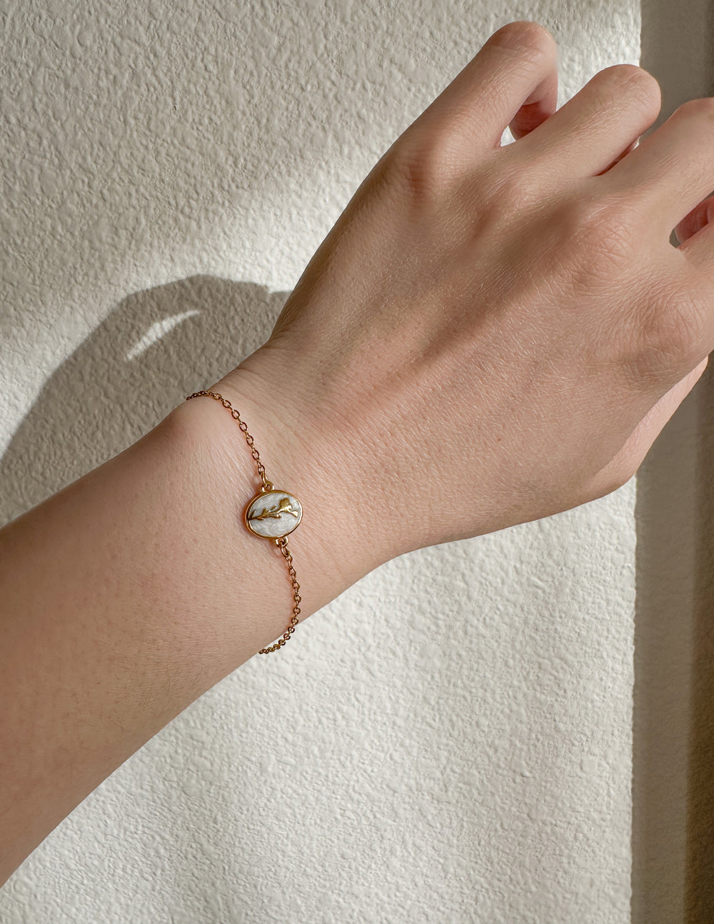 Elevated Faith Christian Jewelry Bracelet with a delicate gold chain and marble accent for stylish wear