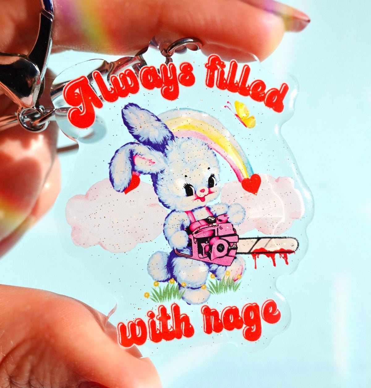 Funny Acrylic keychain with cartoon rabbit, rainbow, clouds, hearts, and red text design