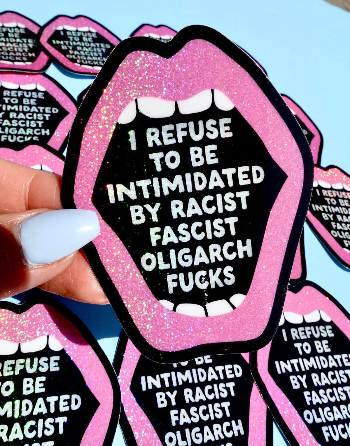 Funny Pink glitter lip-shaped sticker with bold white anti-fascist slogan on black background