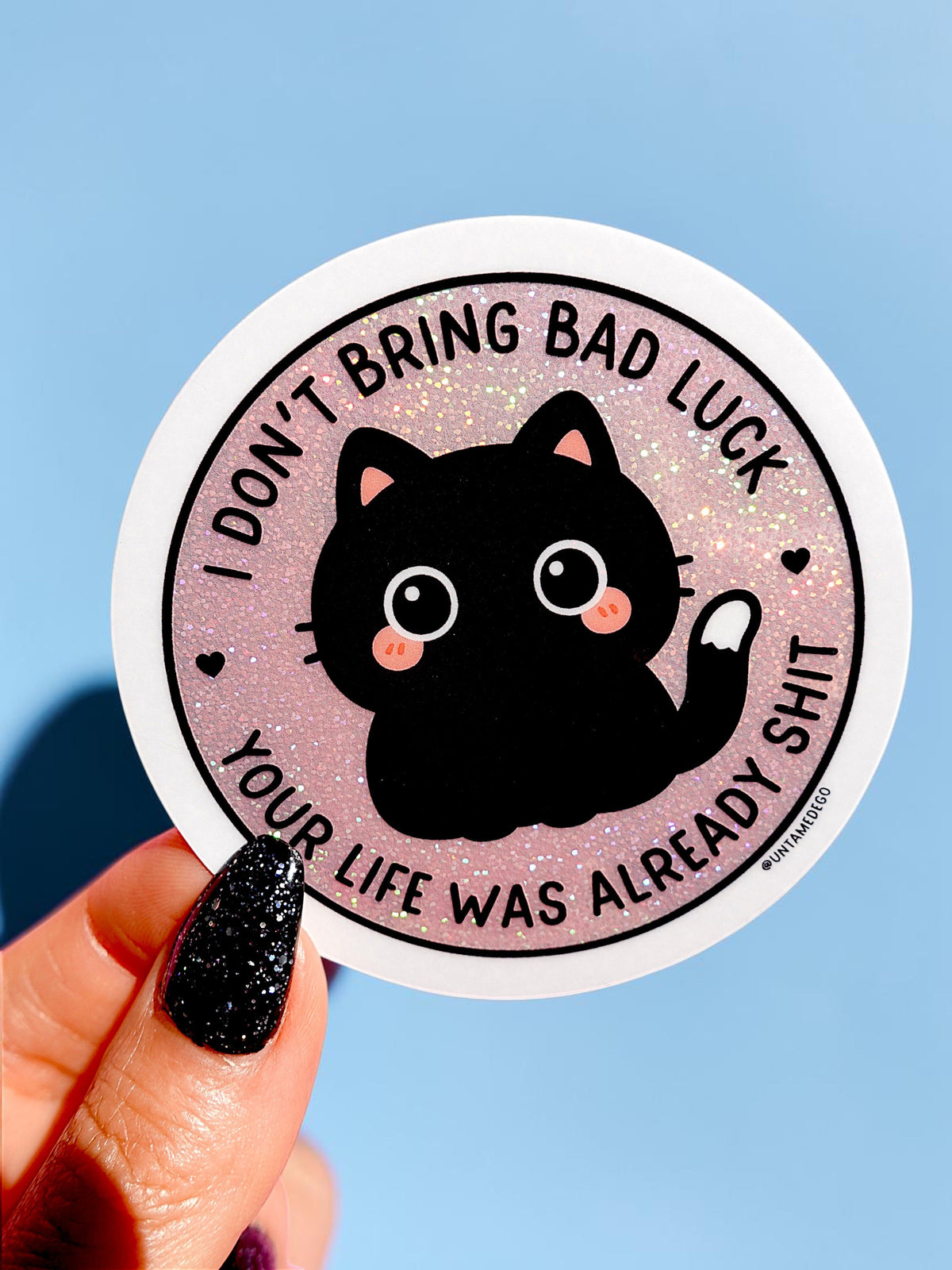 Funny Luck-themed black cat sticker with pink glitter text and heart accents