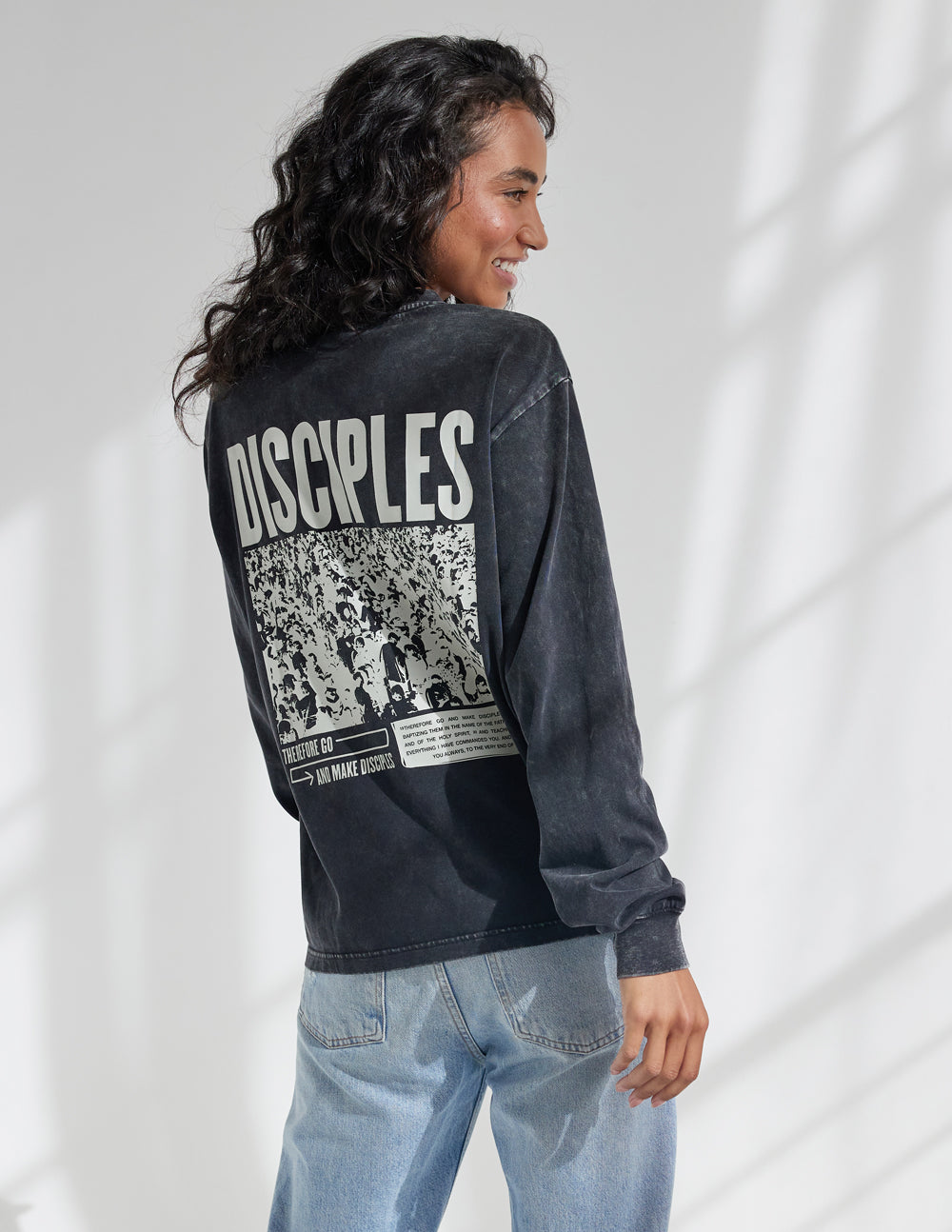 Elevated Faith Christian Apparel T-Shirt featuring a bold 'Disciples' design on the back