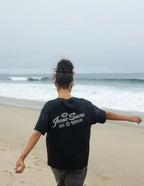 Elevated Faith Christian Apparel T-Shirt in black with Jesus Saves graphic on a beach