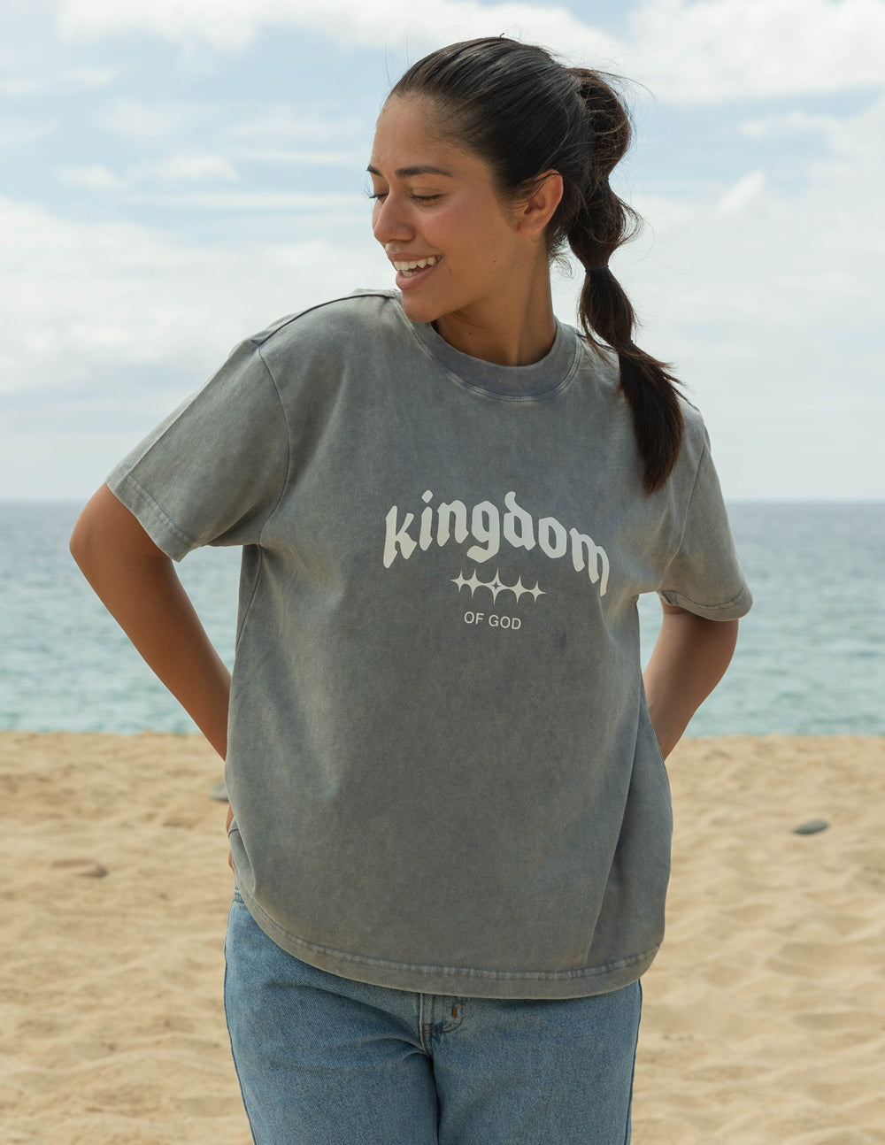 Elevated Faith Christian Apparel T-Shirt in gray with 'kingdom of God' design on a beach