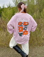 Elevated Faith Christian Apparel T-Shirt in pink featuring floral design on the back