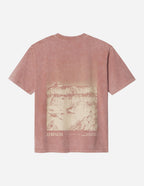 Elevated Faith Christian Apparel T-Shirt in pink with graphic of mountains and the word 'STRENGTH' on the back